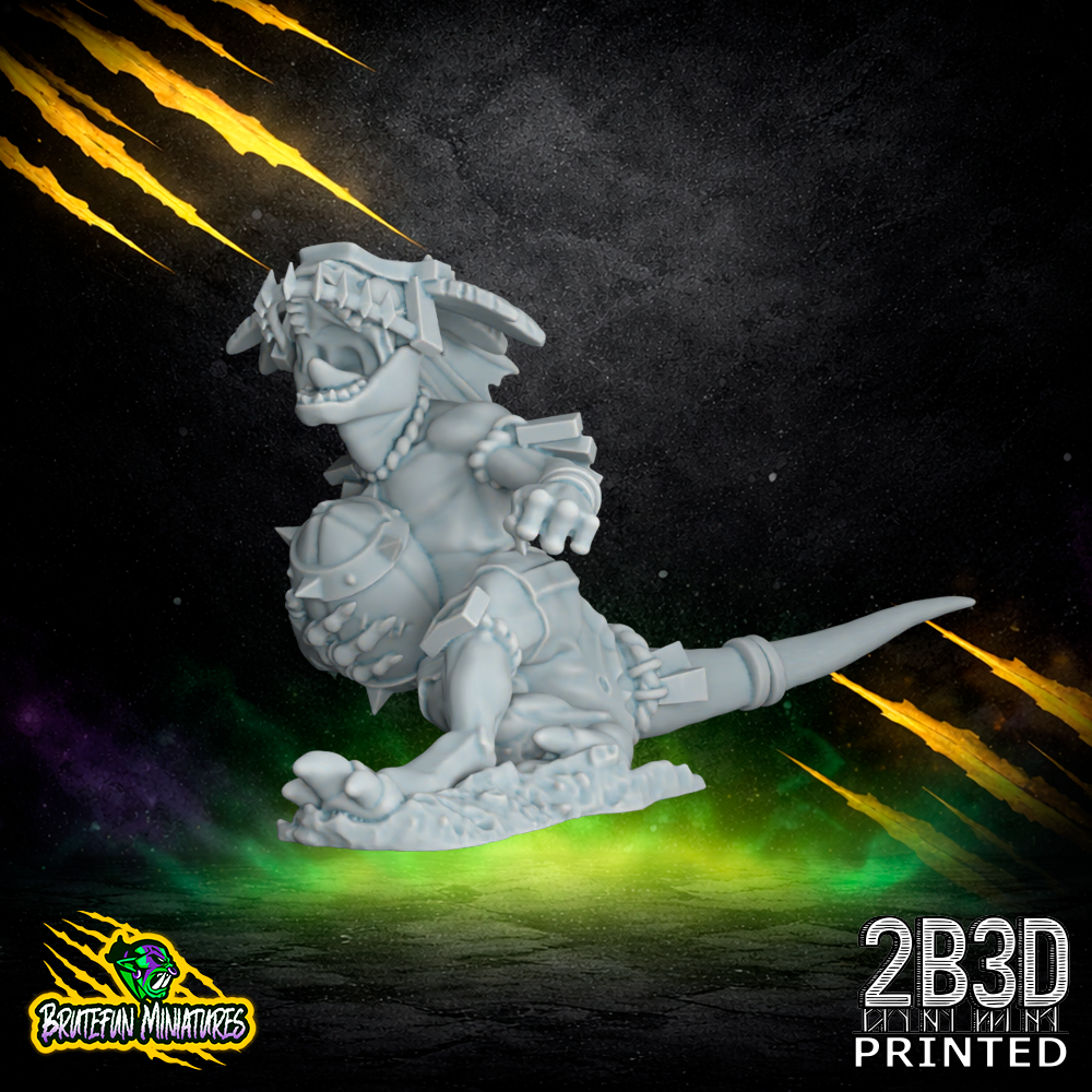 A 32mm scale resin Skink 07 miniature with a feathered headdress and holding a fantasy football ball. Sculpted by BruteFun Miniatures and printed by 2B3D with intricate scale textures and dynamic movement.