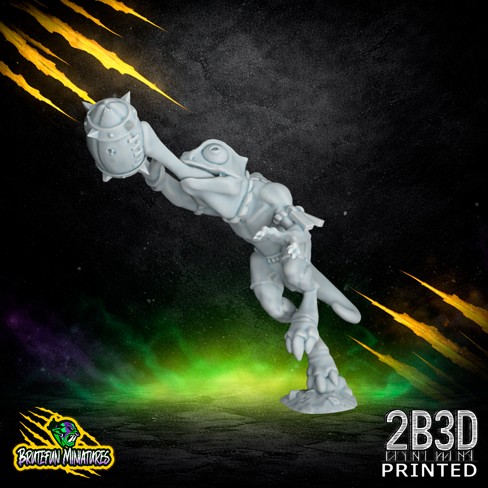 A 32mm high-detail resin Skink Chameleon 01 miniature holding a fantasy football ball. Sculpted by BruteFun Miniatures and printed by 2B3D, the model features distinct large eyes, a curled tail, and textured skin in a dynamic athletic pose.